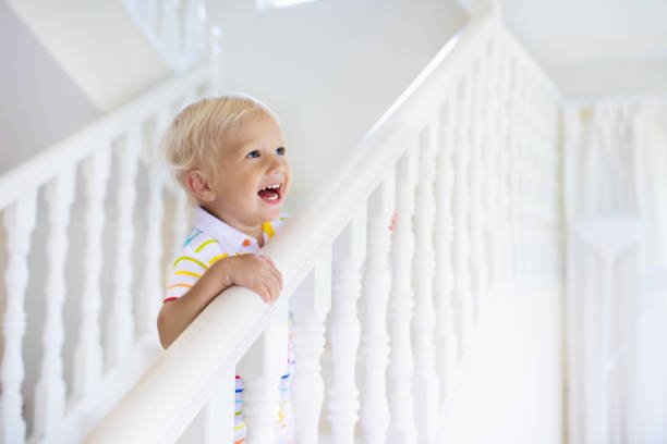 istock Kids on stairs. Child moving into new home. 1005381634