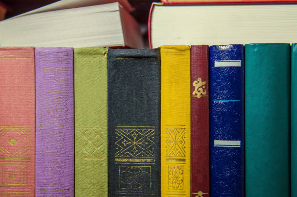 istock a stack of colorful books on the shelf 1005381906