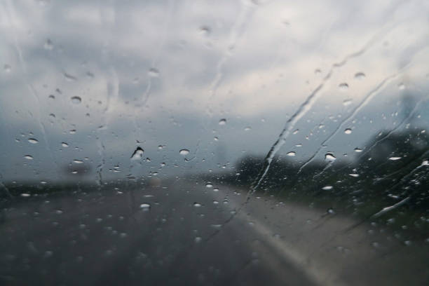 istock Car's wind screen, driving through the rain 1005418352