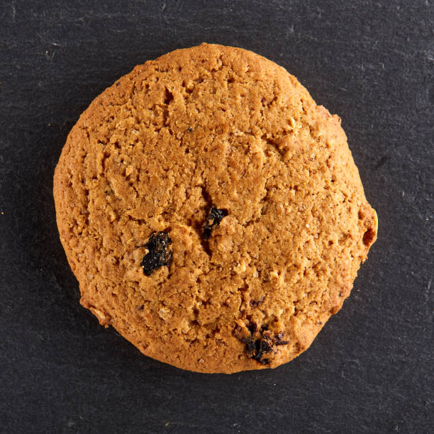 istock Chocolate chips cookies isolated on black background, macro, close-up 1005423796