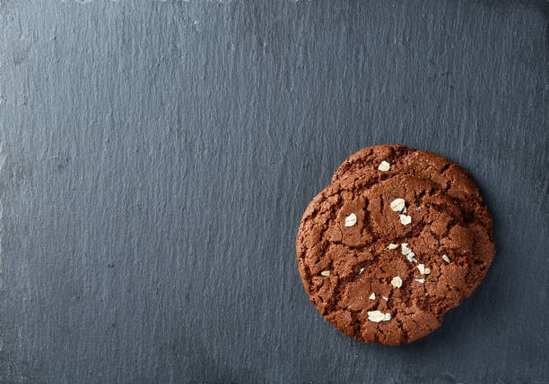 istock Chocolate chips cookies isolated on black background, macro, close-up 1005426128