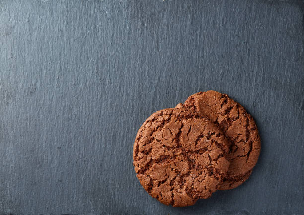 istock Chocolate chips cookies isolated on black background, macro, close-up 1005428396