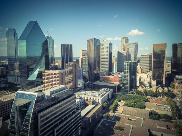 istock Aerial view Downtown Dallas skyscrapers under cloud blue sky 1005435572