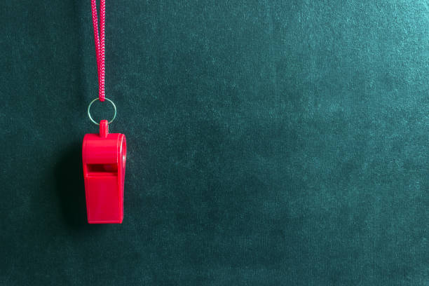 Sports whistle on a red lace.Concept- sport competition, referee, statistics, challenge, friendly match. Sports whistle on a red lace.Concept- sport competition, referee, statistics, challenge, friendly match.Copy space. judge sports official stock pictures, royalty-free photos & images