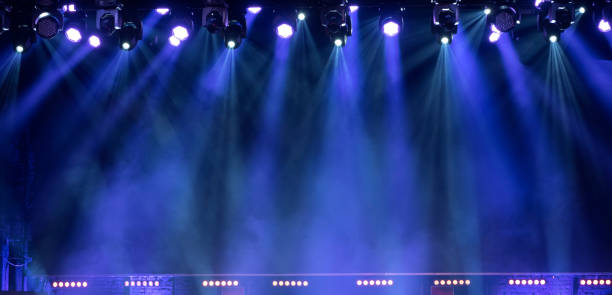 light in the theater. Light from the scene during the concert. stage stock pictures, royalty-free photos & images