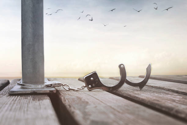 istock freedom concept with a pair of open handcuffs 1005445370