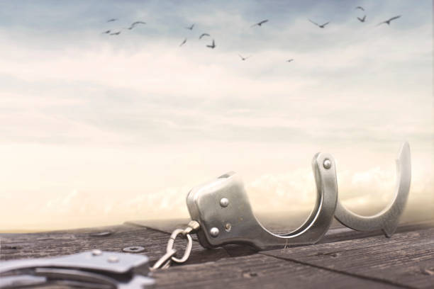 istock freedom concept with a pair of open handcuffs 1005445374