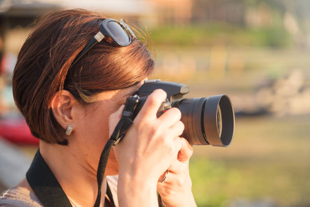 istock Woman Photographer at Sunset 1005449860