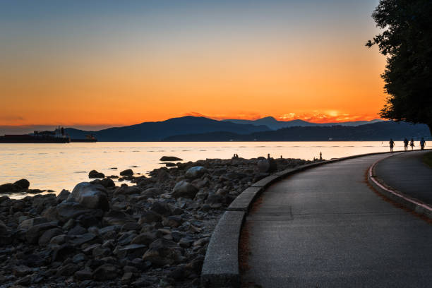 istock Orange Sunset over English Bay in Vancouver, Canada 1005450270