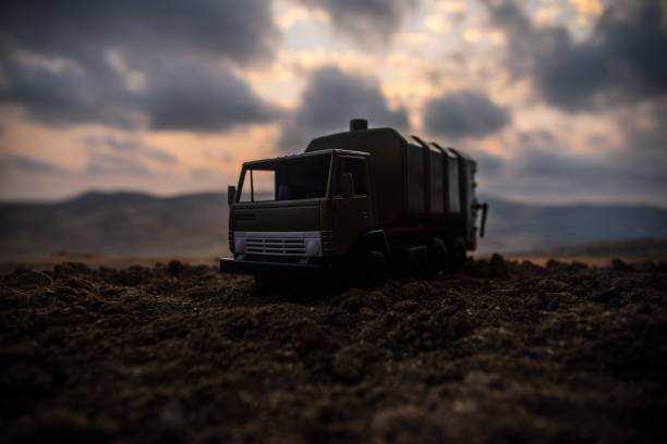 istock War concept. Battle scene with rocket launcher aimed at gloomy sky at sunset time. Rocket vehicle ready to attack on cloudy war Background. 1005463464