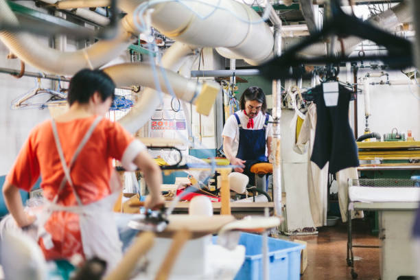 istock Two people working in dry cleaning shop 1005469316