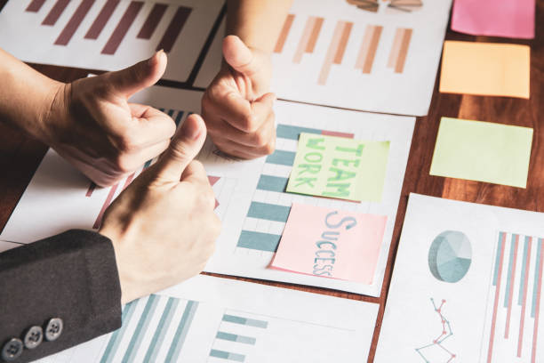 istock Group asian businessman together create a mutually beneficial business relationship. Teamwork 1005470098