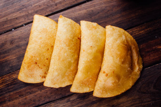 istock Fried empanadas, stuffed with chicken and meat 1005476620