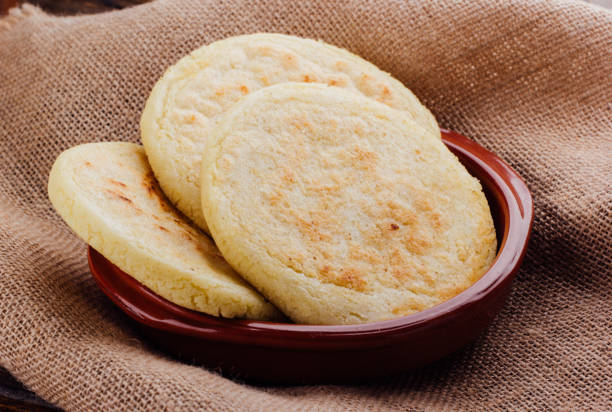 istock Plate with arepas on a rustic wooden background 1005477270