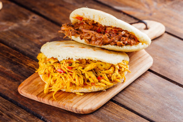 istock Typical South American breakfast, arepa with chicken and roasted meat 1005479800