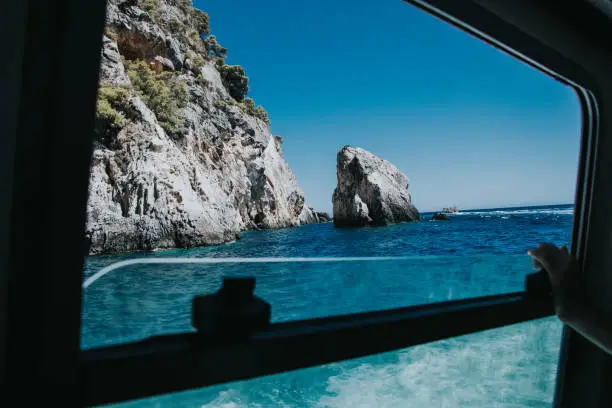 View of the sea through the window of the boat.