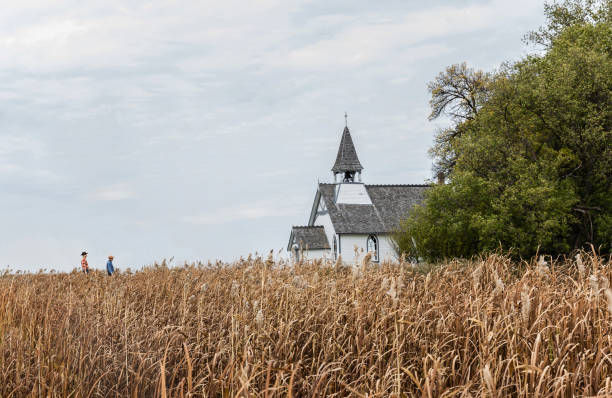istock two cowboys walking toward a church. 1005490094