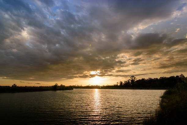 istock Beautiful orange  sky just before sunset with sunbeams 1005495286