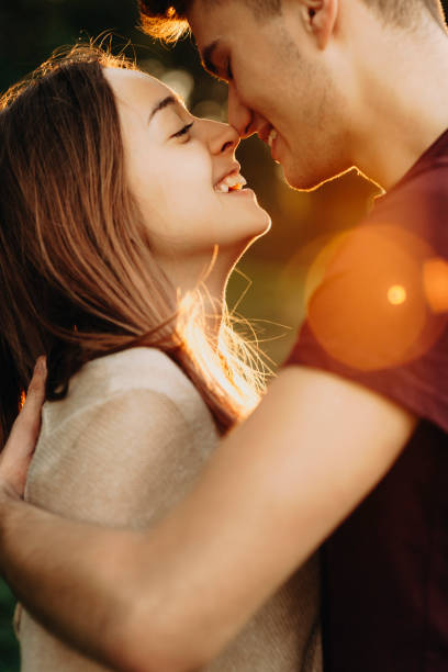 istock Loving young couple laughing in sunset 1005496034