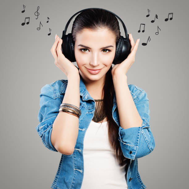 istock Young happy woman with headphones 1005498826