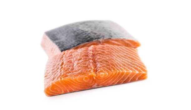 istock Raw Salmon fillet isolated on white background. 1005500104