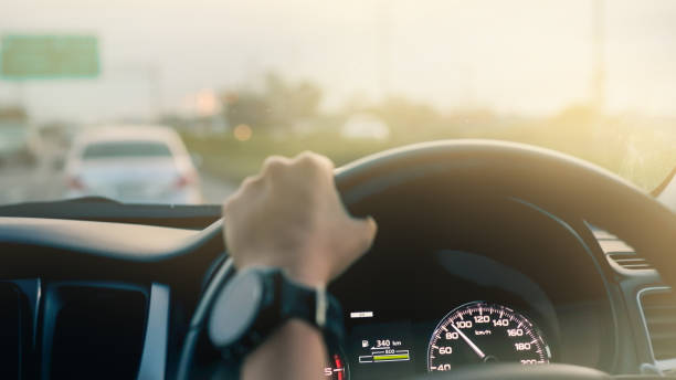 istock Driving a modern car on the road. 1005505188