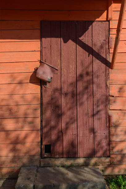 istock closed old wooden door painted in red 1005507742