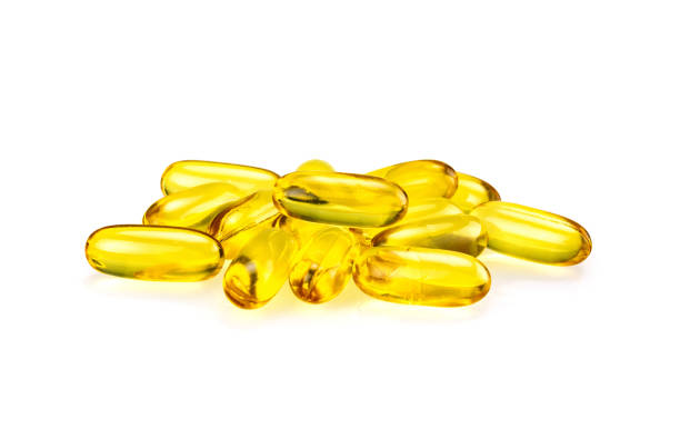 istock Fish oil supplement capsules isolated on white background 1005508526