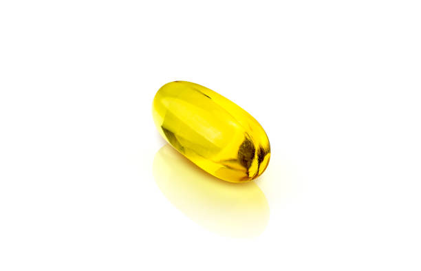 istock Fish oil supplement capsules isolated on white background 1005508630