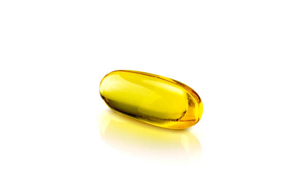 istock Fish oil supplement capsules isolated on white background 1005508696