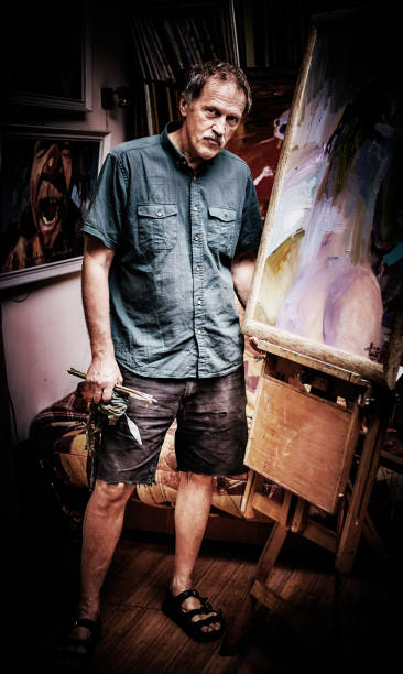istock Portrait confident artist standing in art studio 1005513788
