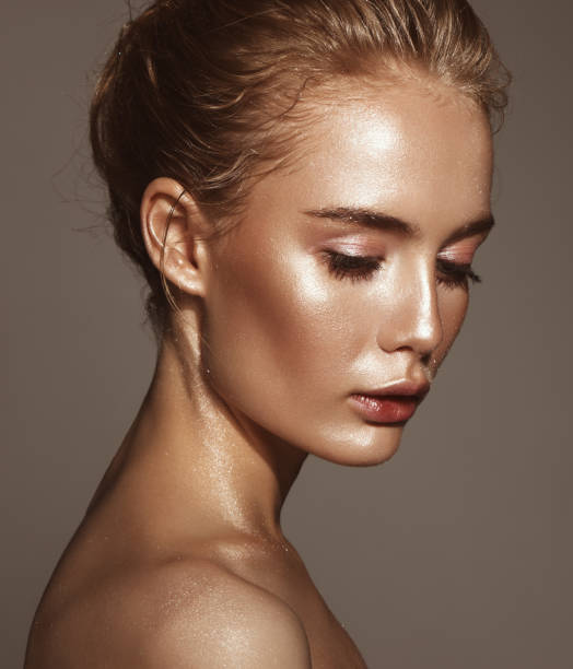 istock Beautiful woman with shiny make-up 1005517344