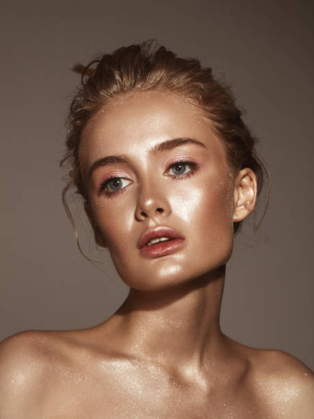 istock Beautiful woman with shiny make-up 1005517406