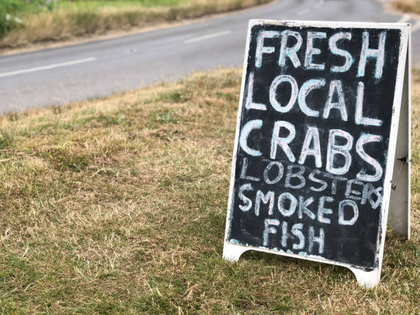 istock Roadside fish for sale chalkboard sign 1005520884