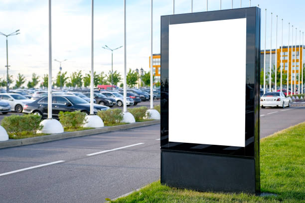 istock Black billboard on the background of a modern city. Mockup image. 1005523636