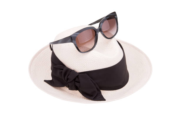 istock Light summer hat and sunglasses on a white background 1005529736