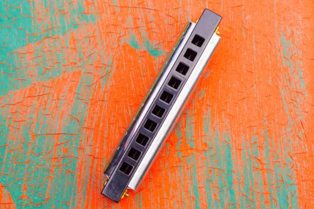 Photo of Slanted Harmonica on Painted Table