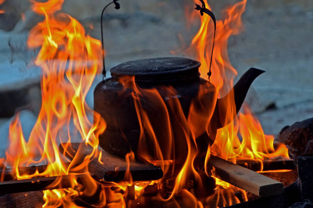 istock black old cast iron kettle at the stake. hiking, trekking. 1005549624