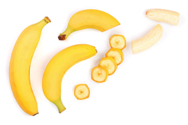 istock whole and sliced bananas isolated on white background with copy space for your text. Top view. Flat lay 1005553142