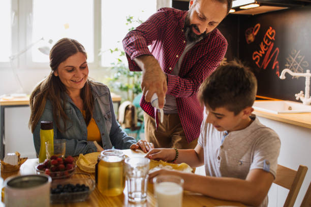 istock Happy family having breakfast 1005555580