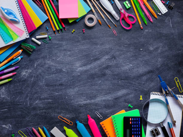 istock School Supplies In Frame On Blackboard 1005556264
