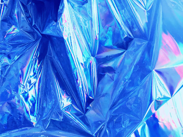 istock Holographic iridescent surface of wrinkled foil 1005560656