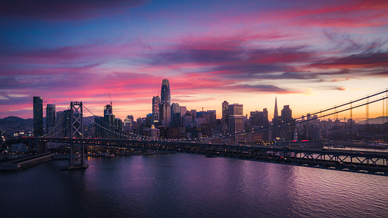 Aerial Cityscape view of San Francisco and the Bay Bridge with Colorful Sunset, California, USA