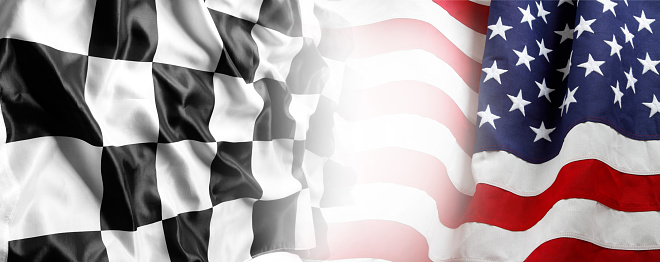 American flag and checkered racing flag