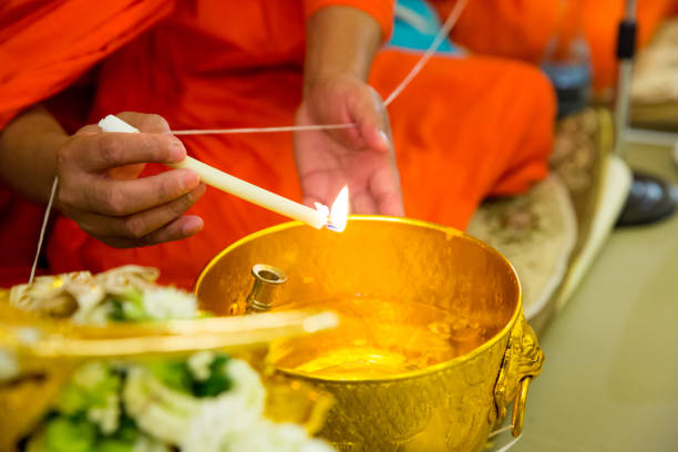 istock Close up monk do holy water in wedding ceremony 1005604272