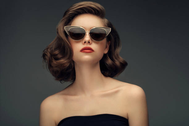 Studio shot of young beautiful woman Studio shot of young beautiful woman pics for classic pin up poses stock pictures, royalty-free photos & images