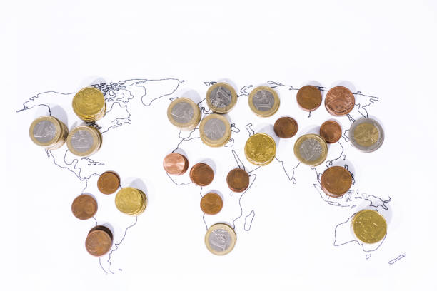 istock A lot of coins on World Map 1005612528