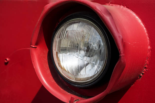 istock Big black headlight of old tractor. 1005613462