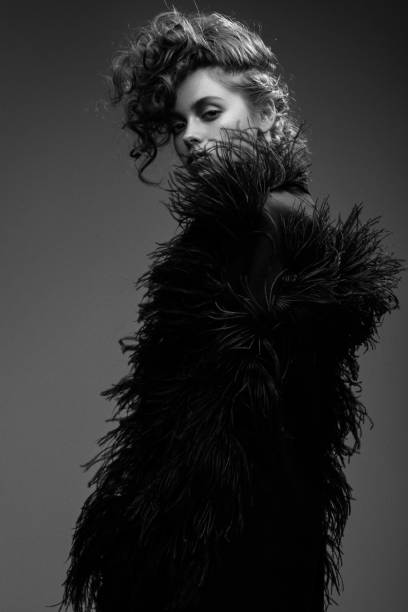 istock Beautiful woman on dark background 1005613670