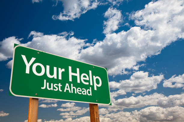 istock Your Help Green Road Sign 1005613674
